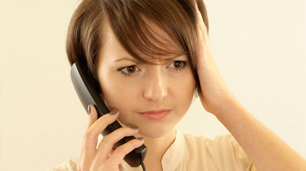 Angry-young-woman-with-a-phone-via-Shutterstock - National ComTel